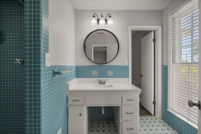 989 Lee Road 0213, Phenix City, AL 36870 - full bathroom featuring tile walls, a wainscoted wall, tiled shower, and vanity
