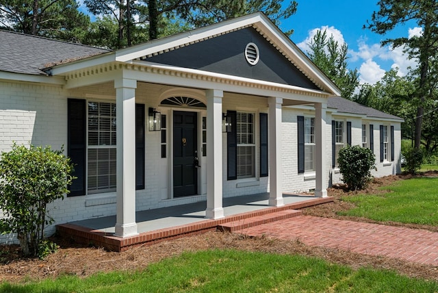 989 Lee Road 0213, Phenix City, AL 36870 - view of front of home with brick siding, covered porch, and roof with shingles