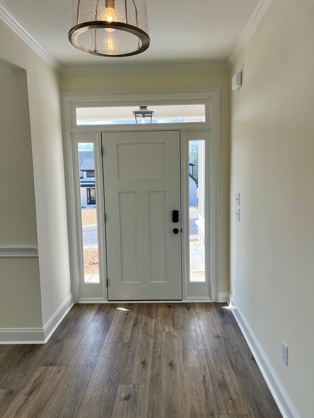 spare room with light carpet, a barn door, plenty of natural light, and lofted ceiling