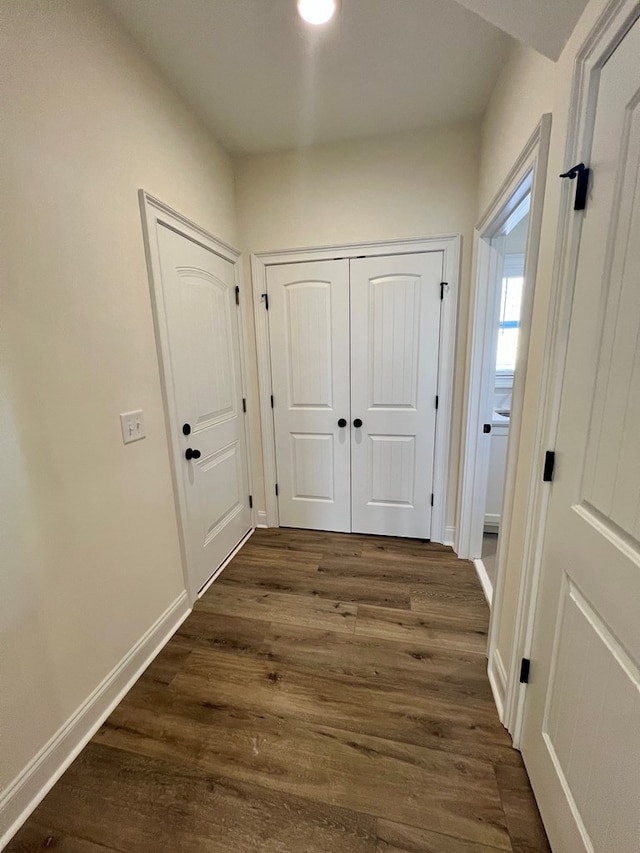 corridor featuring dark hardwood / wood-style flooring