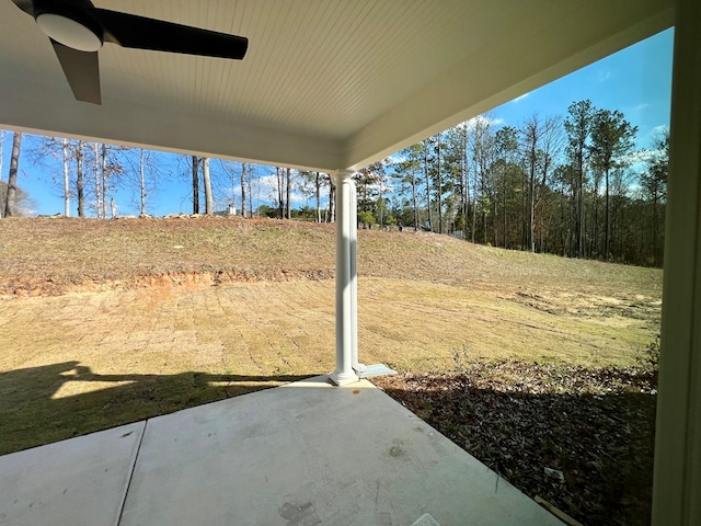 view of yard with a patio area and ceiling fan