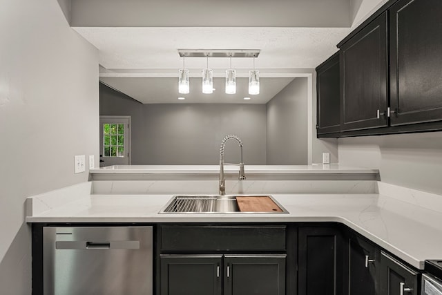 6344 Olde Towne Dr, Columbus, GA 31907 - kitchen featuring stainless steel dishwasher, rail lighting, dark cabinets, and light stone counters