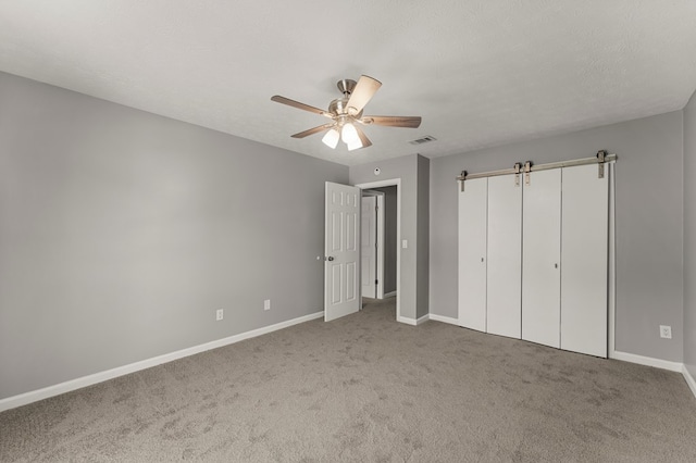6344 Olde Towne Dr, Columbus, GA 31907 - unfurnished bedroom with carpet flooring, a ceiling fan, and a closet
