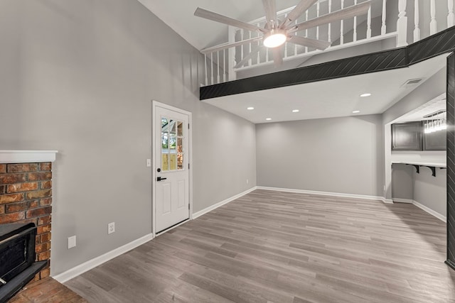 6344 Olde Towne Dr, Columbus, GA 31907 - unfurnished living room with wood finished floors, ceiling fan, and a high ceiling