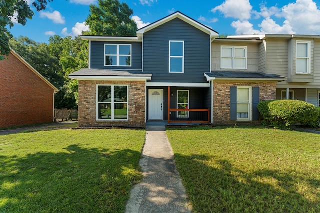 6344 Olde Towne Dr, Columbus, GA 31907 - view of front of property featuring covered porch, brick siding, and a front lawn
