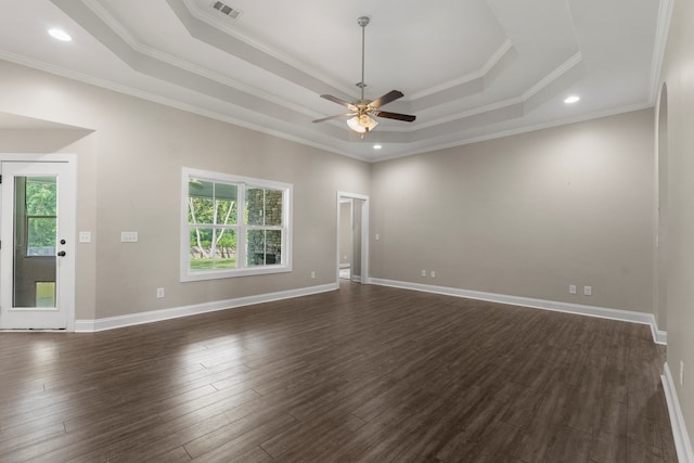 unfurnished room featuring dark hardwood / wood-style floors, a healthy amount of sunlight, and ornamental molding