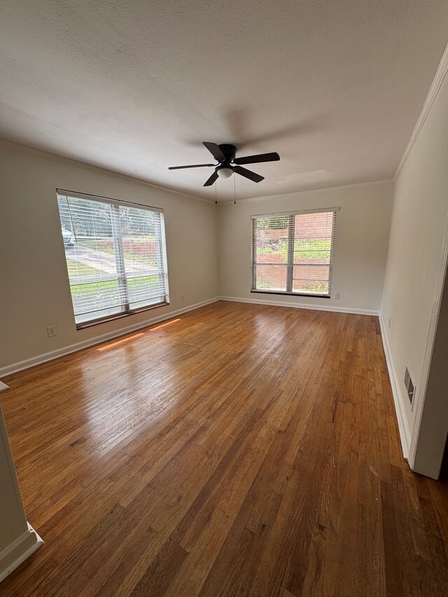 3328 College Ave, Columbus, GA 31907 - spare room with wood finished floors, plenty of natural light, ceiling fan, and crown molding