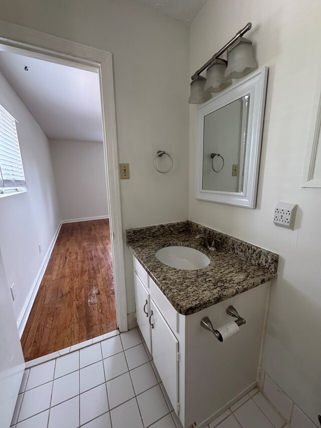 3328 College Ave, Columbus, GA 31907 - bathroom with vanity and wood finished floors