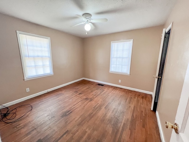 427 Bernard Dr, Columbus, GA 31903 - spare room with healthy amount of natural light, ceiling fan, and wood finished floors