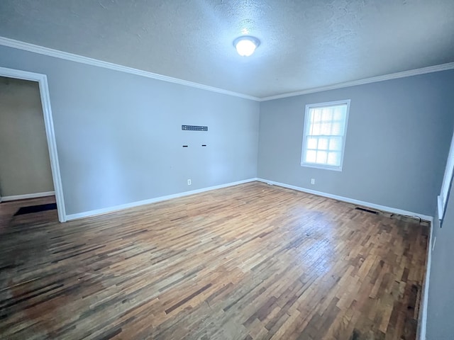 427 Bernard Dr, Columbus, GA 31903 - unfurnished room featuring wood finished floors, a textured ceiling, and crown molding
