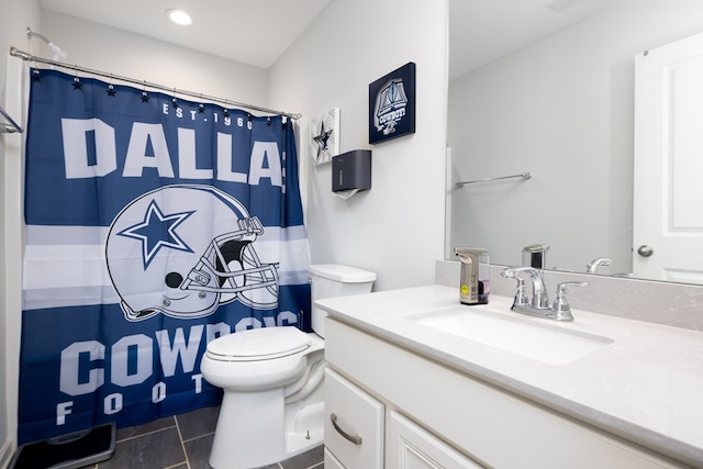 bathroom with tile patterned flooring, vanity, curtained shower, and toilet