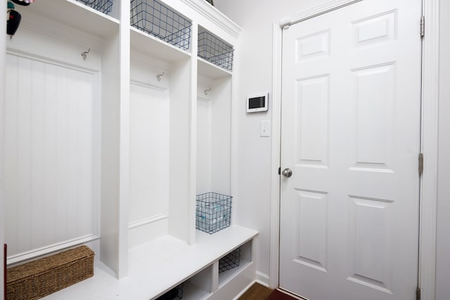 mudroom with dark wood-type flooring