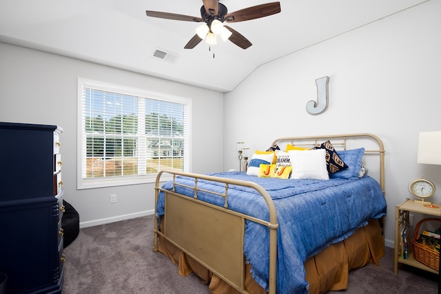 carpeted bedroom with ceiling fan and vaulted ceiling