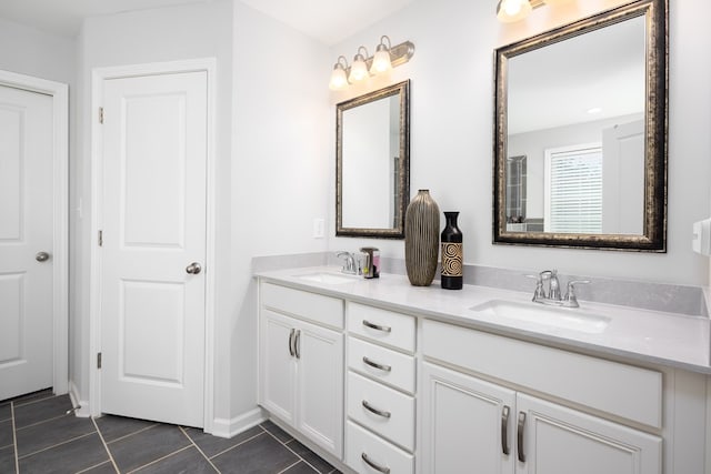 bathroom featuring tile patterned flooring and vanity