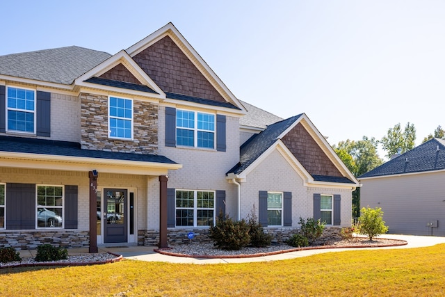 craftsman house with a front yard