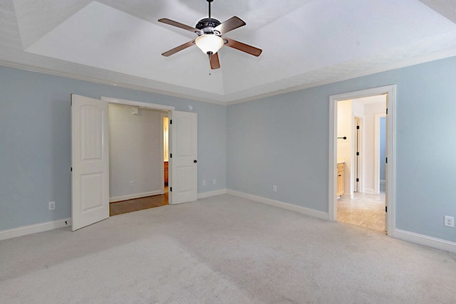7177 Helen Dr, Columbus, GA 31904 - unfurnished bedroom with carpet floors, a tray ceiling, baseboards, ornamental molding, and ceiling fan