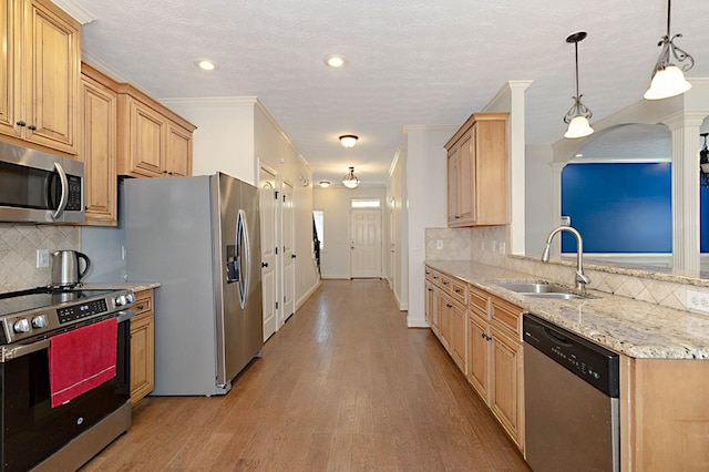 7177 Helen Dr, Columbus, GA 31904 - kitchen with appliances with stainless steel finishes, a sink, tasteful backsplash, light wood-style floors, and recessed lighting