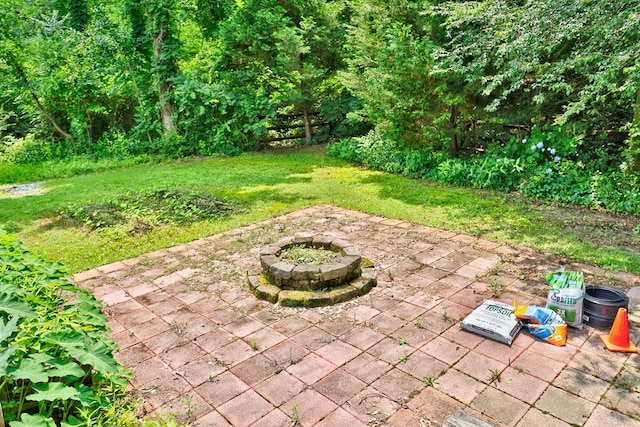 7177 Helen Dr, Columbus, GA 31904 - view of grassy yard featuring a patio area and an outdoor fire pit