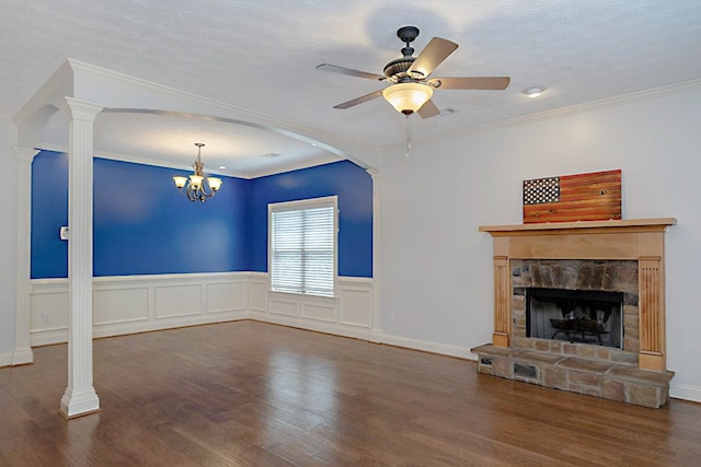 7177 Helen Dr, Columbus, GA 31904 - unfurnished living room featuring a stone fireplace, wood finished floors, a chandelier, ceiling fan, and arched walkways