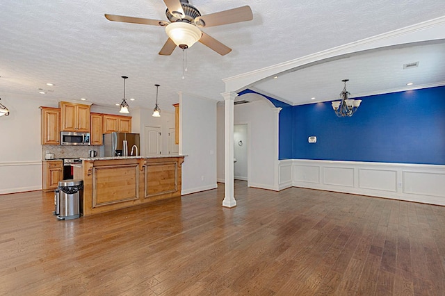 7177 Helen Dr, Columbus, GA 31904 - kitchen featuring stainless steel appliances, open floor plan, arched walkways, ceiling fan, and a chandelier