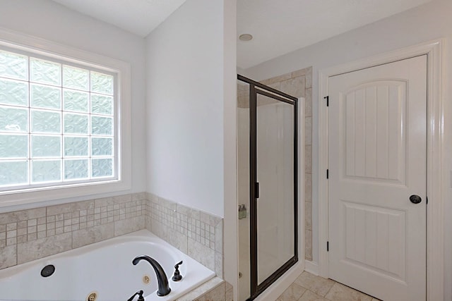 7177 Helen Dr, Columbus, GA 31904 - full bath with plenty of natural light, a stall shower, a whirlpool tub, and tile patterned flooring