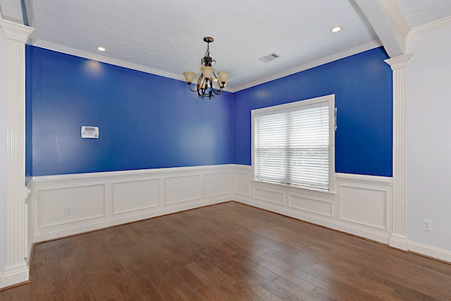 7177 Helen Dr, Columbus, GA 31904 - spare room with a chandelier, decorative columns, wood finished floors, wainscoting, and recessed lighting