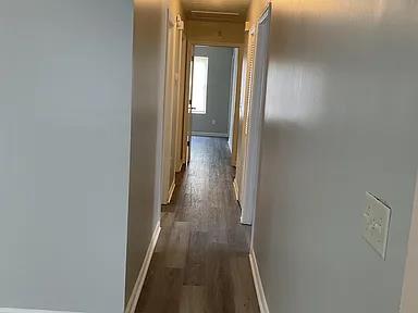 3514 Youmans St, Columbus, GA 31903 - hall with dark wood-type flooring and baseboards