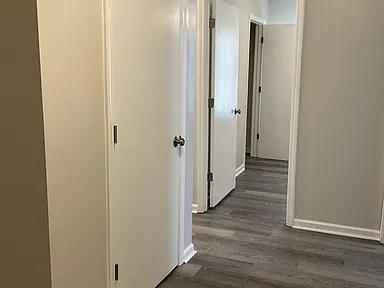 3514 Youmans St, Columbus, GA 31903 - hallway featuring dark wood finished floors and baseboards