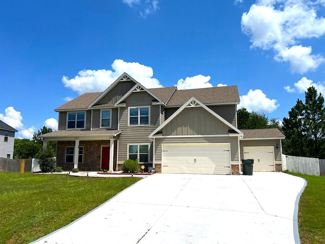 19 Pebblebrook Ln, Fort Mitchell, AL 36856 - craftsman house with stone siding, a garage, board and batten siding, and concrete driveway