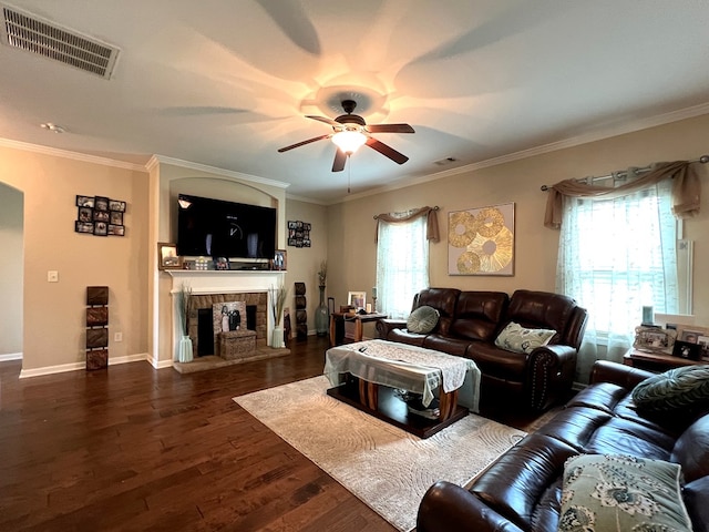 19 Pebblebrook Ln, Fort Mitchell, AL 36856 - living room featuring a ceiling fan, dark wood-style floors, ornamental molding, a fireplace, and arched walkways