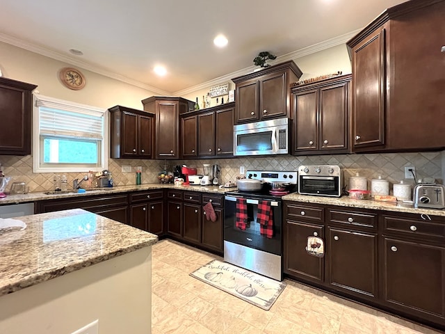 19 Pebblebrook Ln, Fort Mitchell, AL 36856 - kitchen with appliances with stainless steel finishes, dark brown cabinets, light stone countertops, backsplash, and ornamental molding