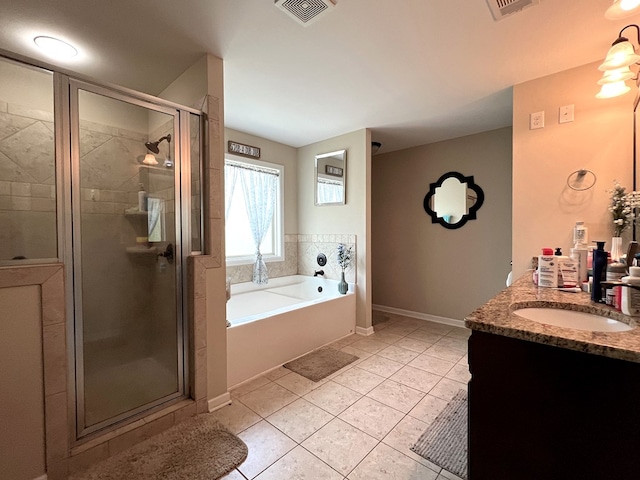 19 Pebblebrook Ln, Fort Mitchell, AL 36856 - full bath featuring a garden tub, a shower stall, vanity, and tile patterned floors