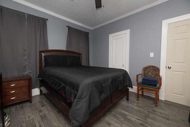 bedroom with a textured ceiling, dark hardwood / wood-style flooring, ceiling fan, and ornamental molding