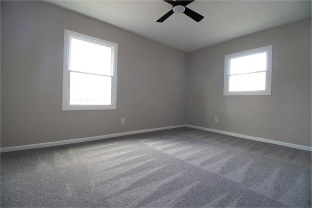 unfurnished room with carpet floors and ceiling fan