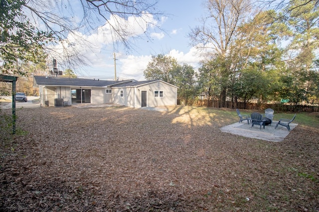 back of property with cooling unit and a patio