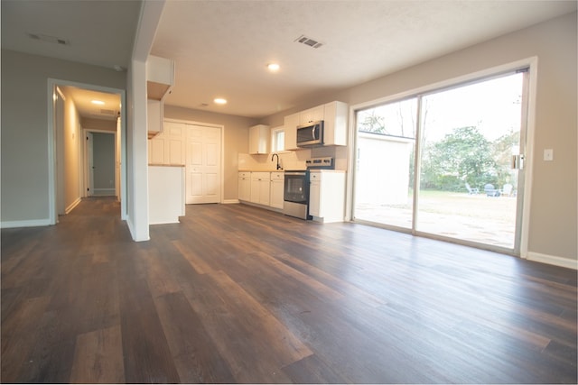 unfurnished living room featuring dark hardwood / wood-style floors