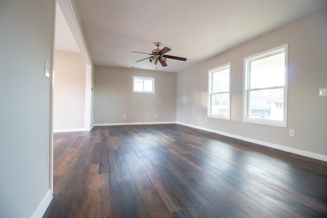 unfurnished room featuring dark hardwood / wood-style floors and ceiling fan