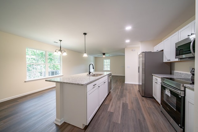 6900 Forrest Rd, Columbus, GA 31907 - kitchen featuring stainless steel appliances, white cabinets, a center island with sink, ceiling fan, and dark wood-style flooring
