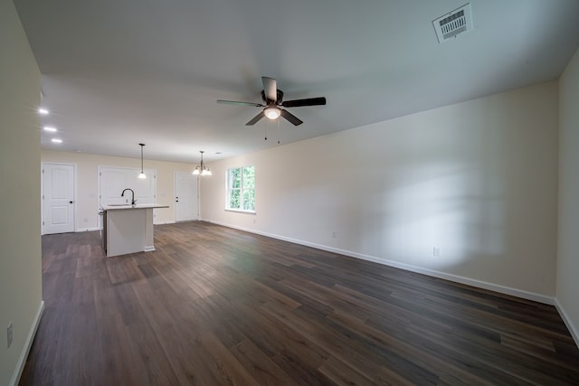 6900 Forrest Rd, Columbus, GA 31907 - unfurnished living room with ceiling fan, a chandelier, and dark wood-style flooring