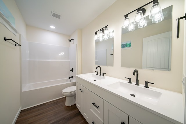 6900 Forrest Rd, Columbus, GA 31907 - full bath featuring double vanity, wood finished floors, tub / shower combination, and recessed lighting