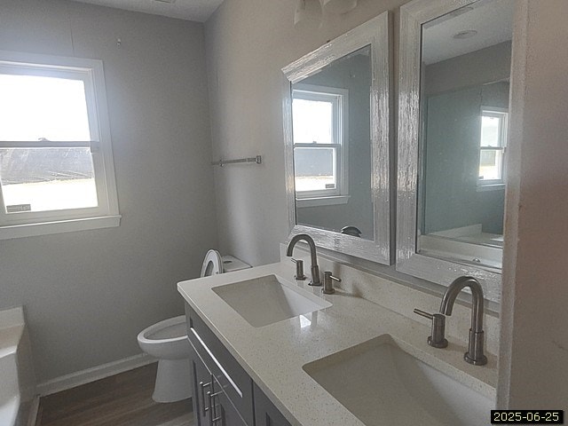 6123 Caribou Dr, Columbus, GA 31907 - full bathroom with double vanity and wood finished floors