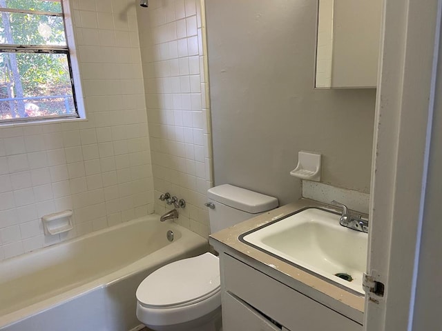 full bathroom with vanity, toilet, and tiled shower / bath