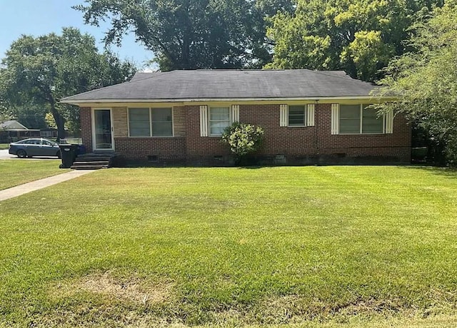 single story home with a front yard, crawl space, and brick siding