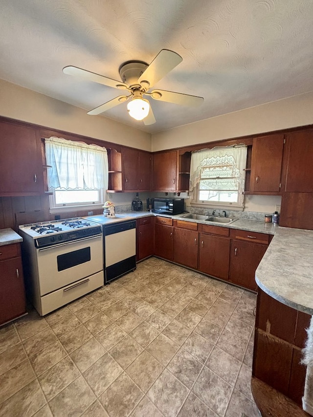 kitchen featuring ceiling fan, white appliances, a sink, light countertops, and open shelves