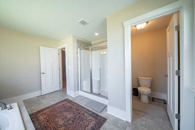 bathroom featuring toilet and plus walk in shower