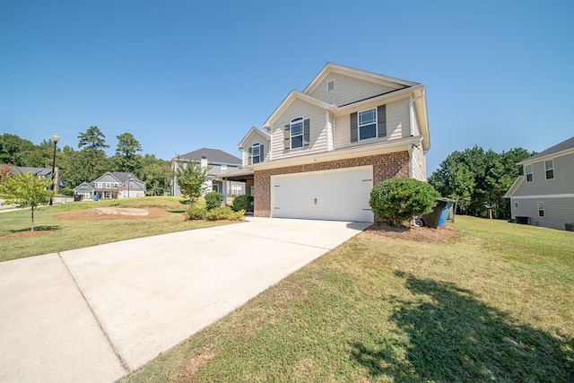 view of front of property featuring a front yard and a garage