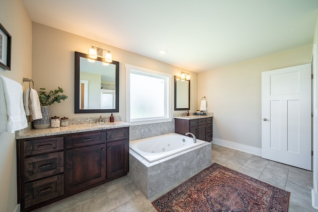 bathroom featuring vanity and a relaxing tiled tub