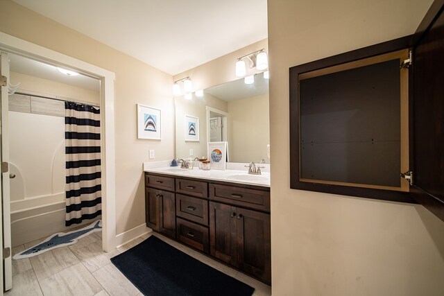 bathroom featuring vanity and shower / bath combo