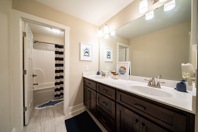 bathroom featuring vanity and shower / tub combo with curtain