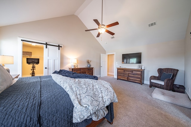 bedroom with ceiling fan, a barn door, carpet floors, and high vaulted ceiling